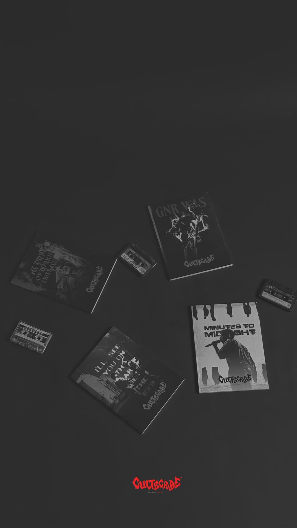 CultScribe collection — four notebooks and three cassette tapes on a dark matte surface.